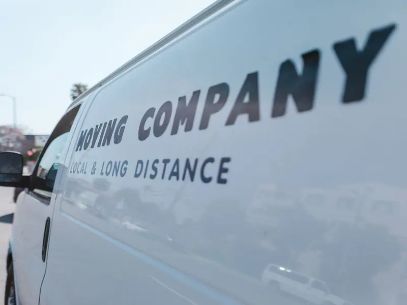 White van with a company name in letters on the side