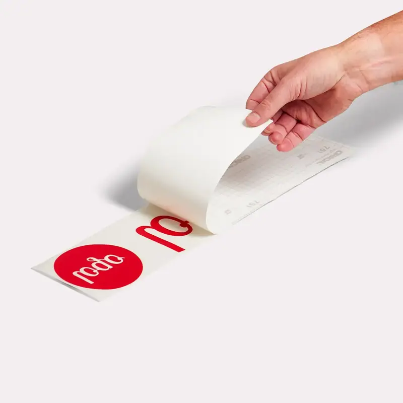 The transfer tape is peeled off the backing