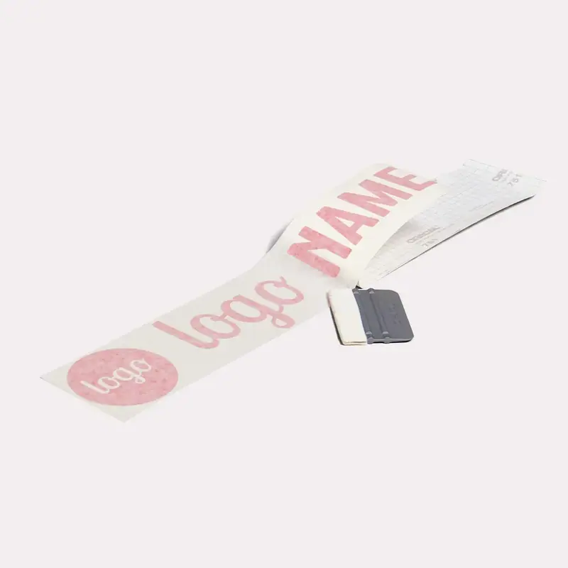 Letters on the backing with a squeegee next to them
